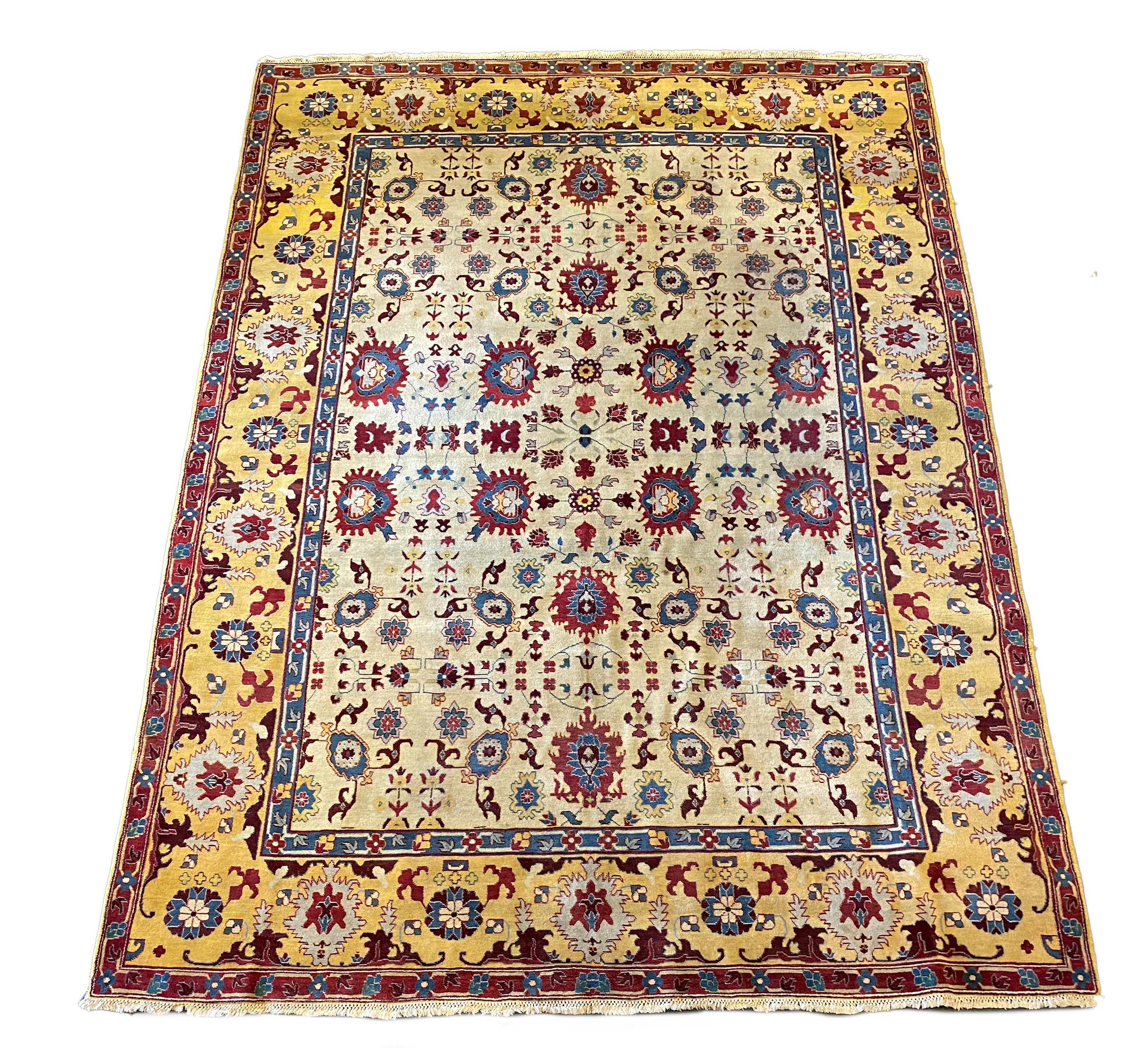 An Agra ivory ground carpet, 360 x 274cm